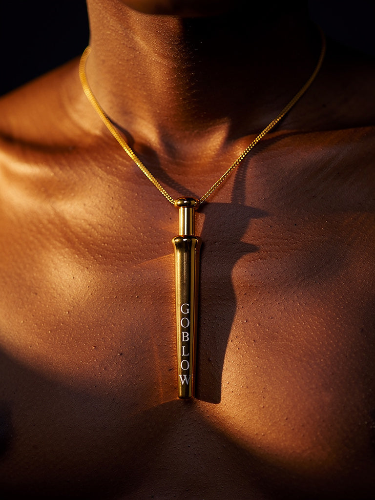 GoBlow Gold pendant — editorial worn gold skin sunlight