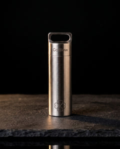 GoBlow Stacks Single — closed, dark hero — machined stainless EDC capsule pendant