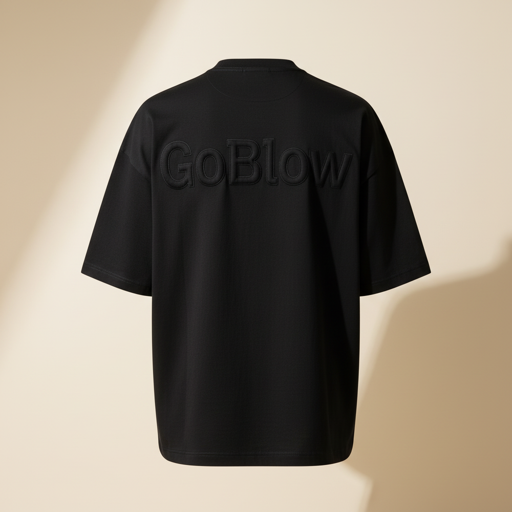 The Heavyweight Tee — back (tonal black-on-black GoBlow)