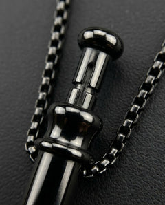 GoBlow Pendant MKII in Black, macro of the bayonet slot — machined stainless EDC capsule pendant