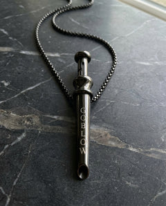 GoBlow Pendant MKII in Black, on marble — machined stainless EDC capsule pendant