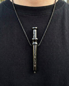 GoBlow Pendant MKII in Black, worn on the chest — machined stainless EDC capsule pendant
