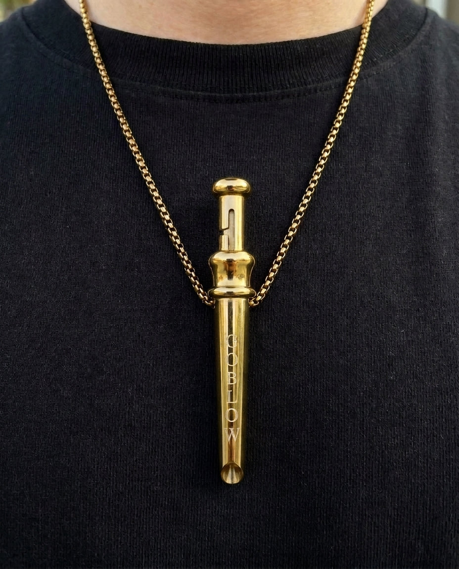 GoBlow Pendant MKII in Gold, worn on the chest