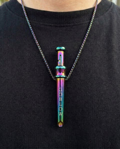 GoBlow Pendant MKII in Rainbow, worn on the chest — machined stainless EDC capsule pendant