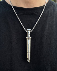 GoBlow Pendant MKII in Steel, worn on the chest — machined stainless EDC capsule pendant