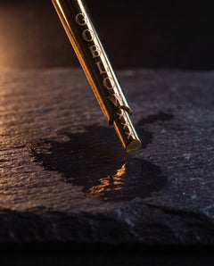 GoBlow MKII Gold — extended detail — machined stainless EDC capsule pendant