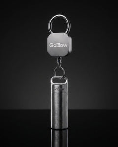 GoBlow Yoyo retractable tether, dark studio — machined stainless EDC capsule pendant